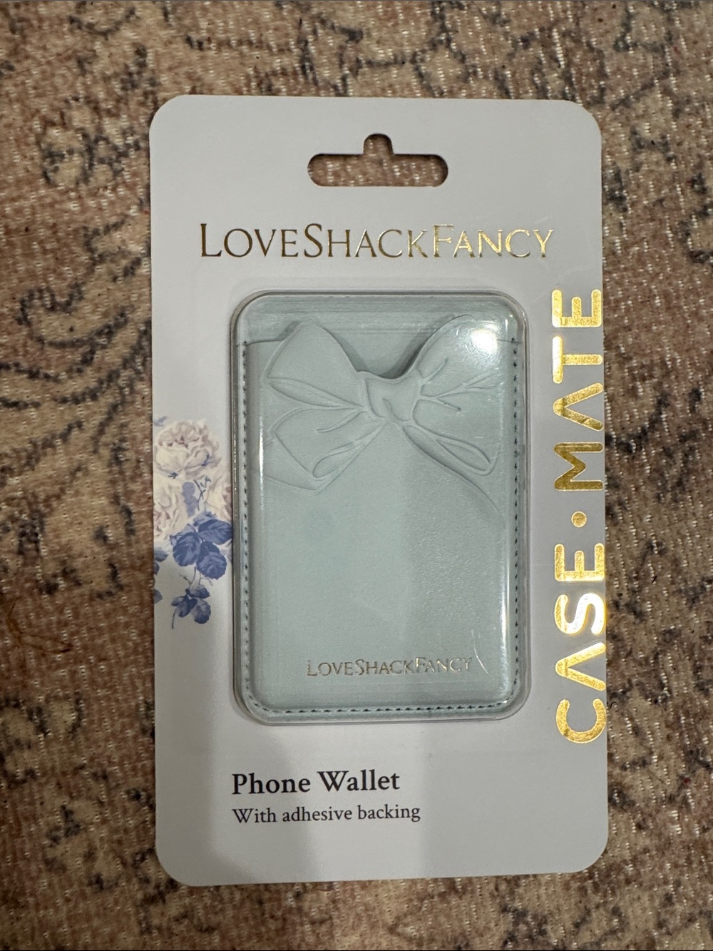 LoveShackFancy Light Blue Adhesive Phone Wallet with Embossed Bow